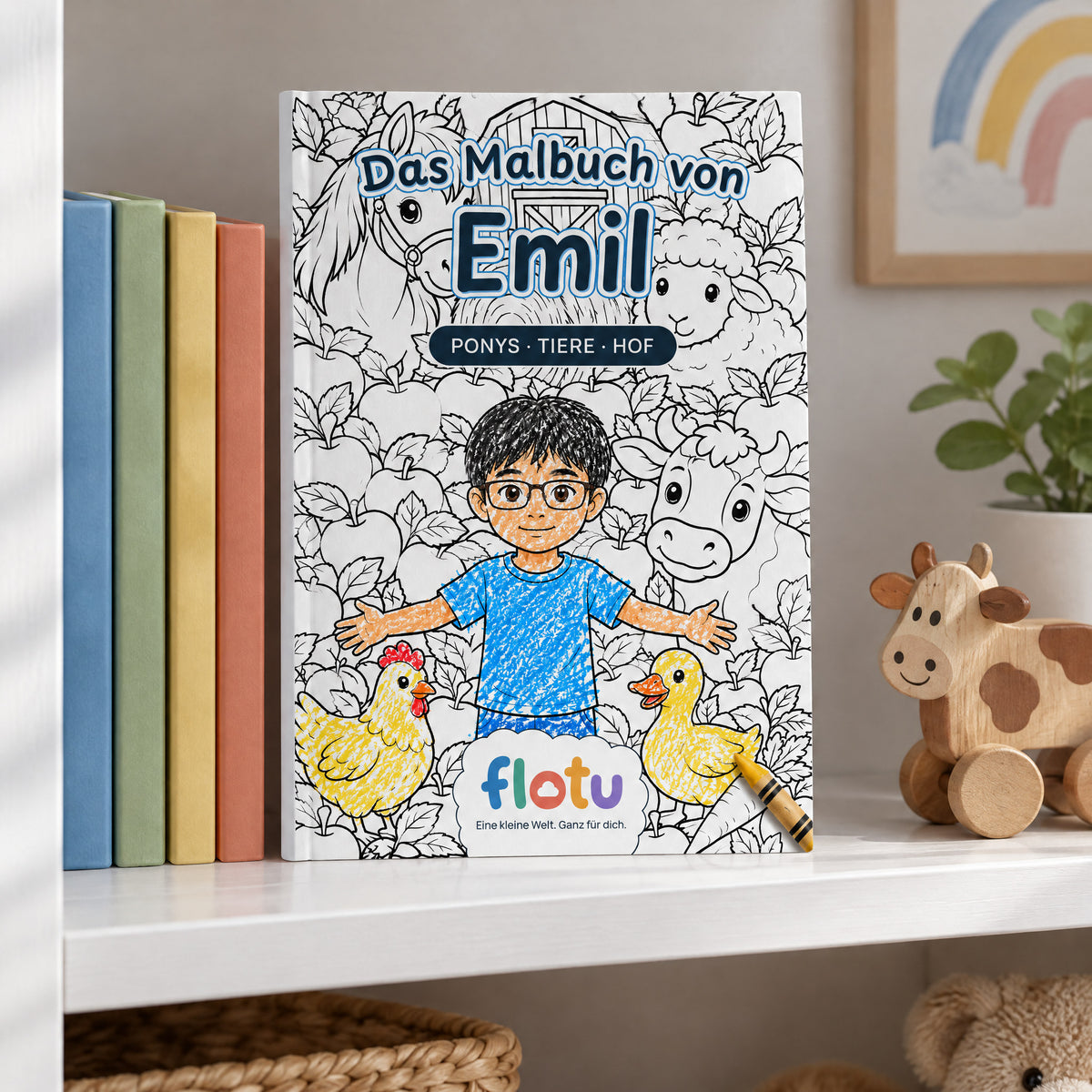 Das gedruckte Malbuch „Bauernhof & Pferdehof“ mit dem Namen Emil auf dem Cover